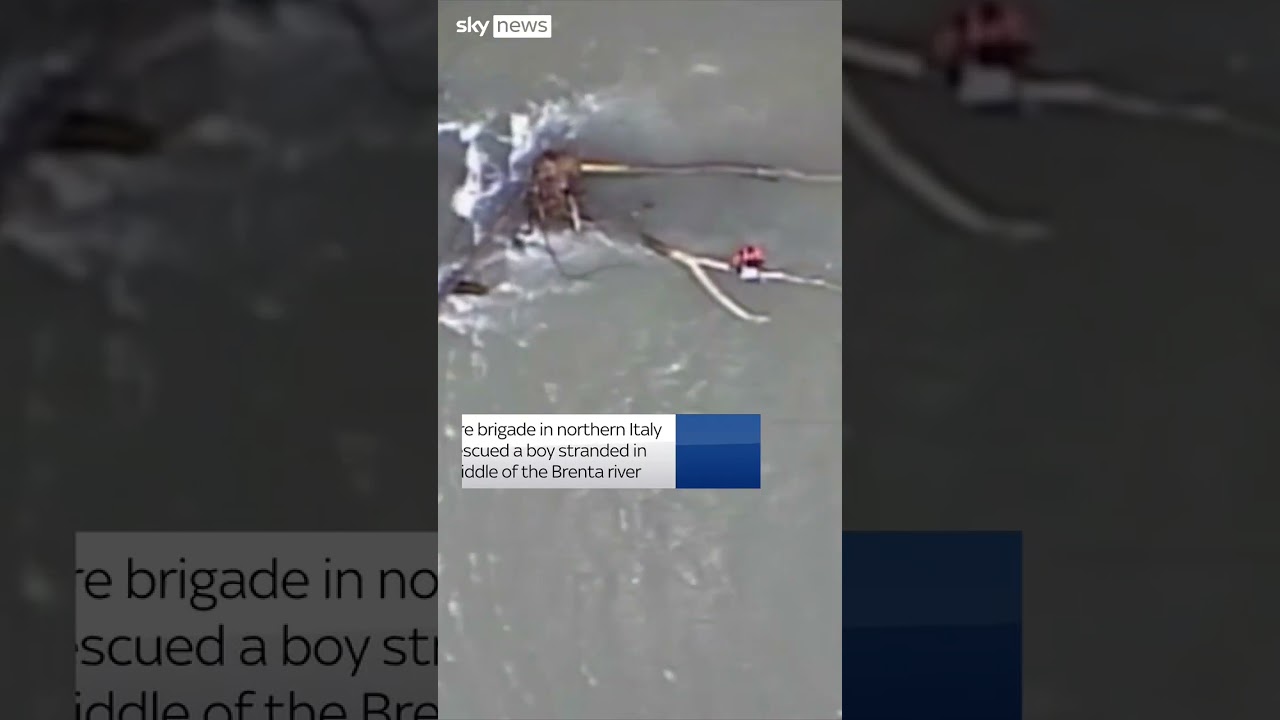 Boy rescued from flooding in Italy