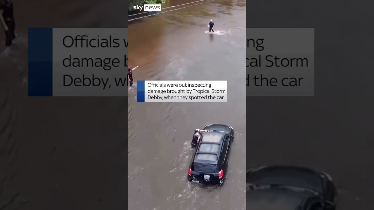 Driver rescued from floodwaters
