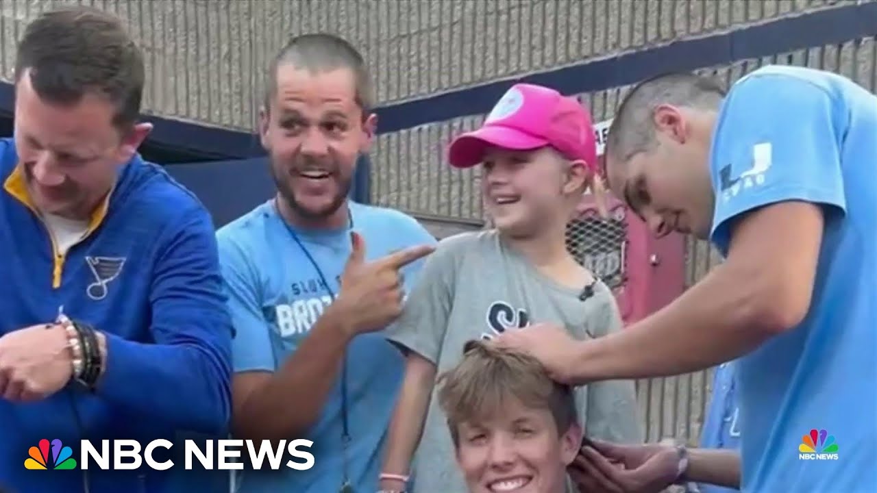 High school football team helping a little girl through a tough time