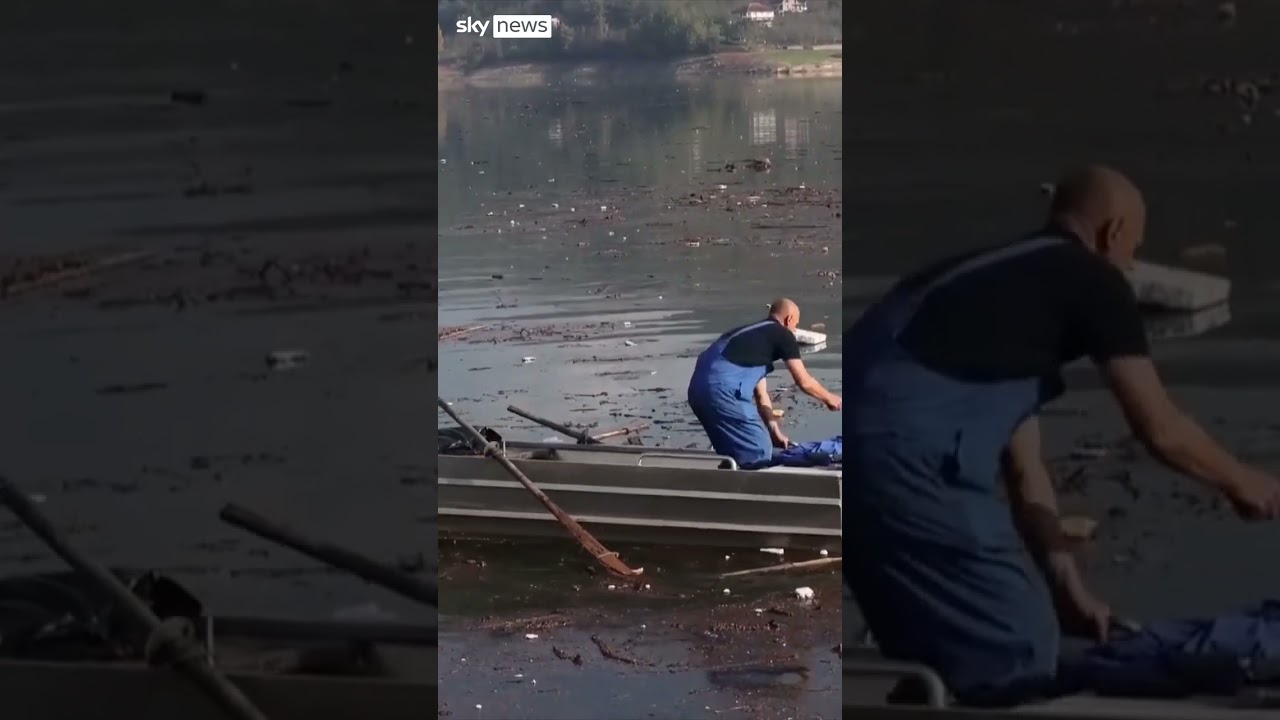 Volunteers clean up lake after deadly floods