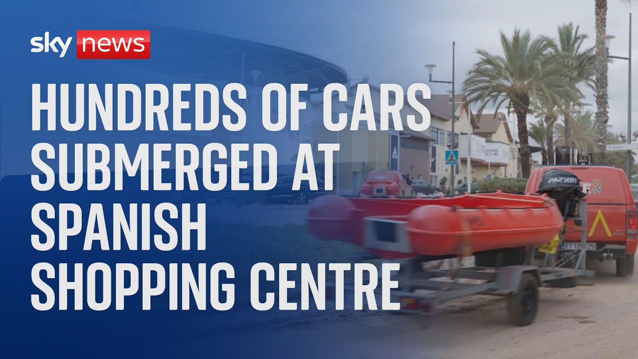 Scuba divers sent to help search and rescue at a flooded car park in Spain