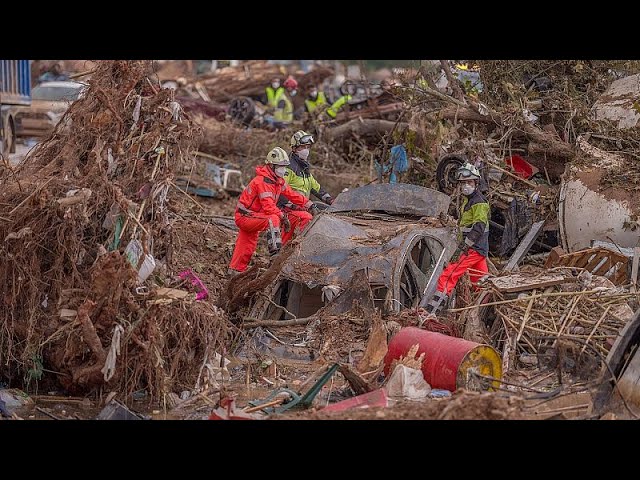 Troops search for more flood victims in Valencia as rain disrupts rail service