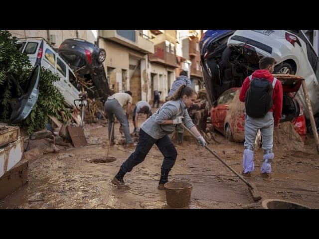Volunteers clean-up Paiporta as Pedro Sánchez mobilises 10,000 more troops