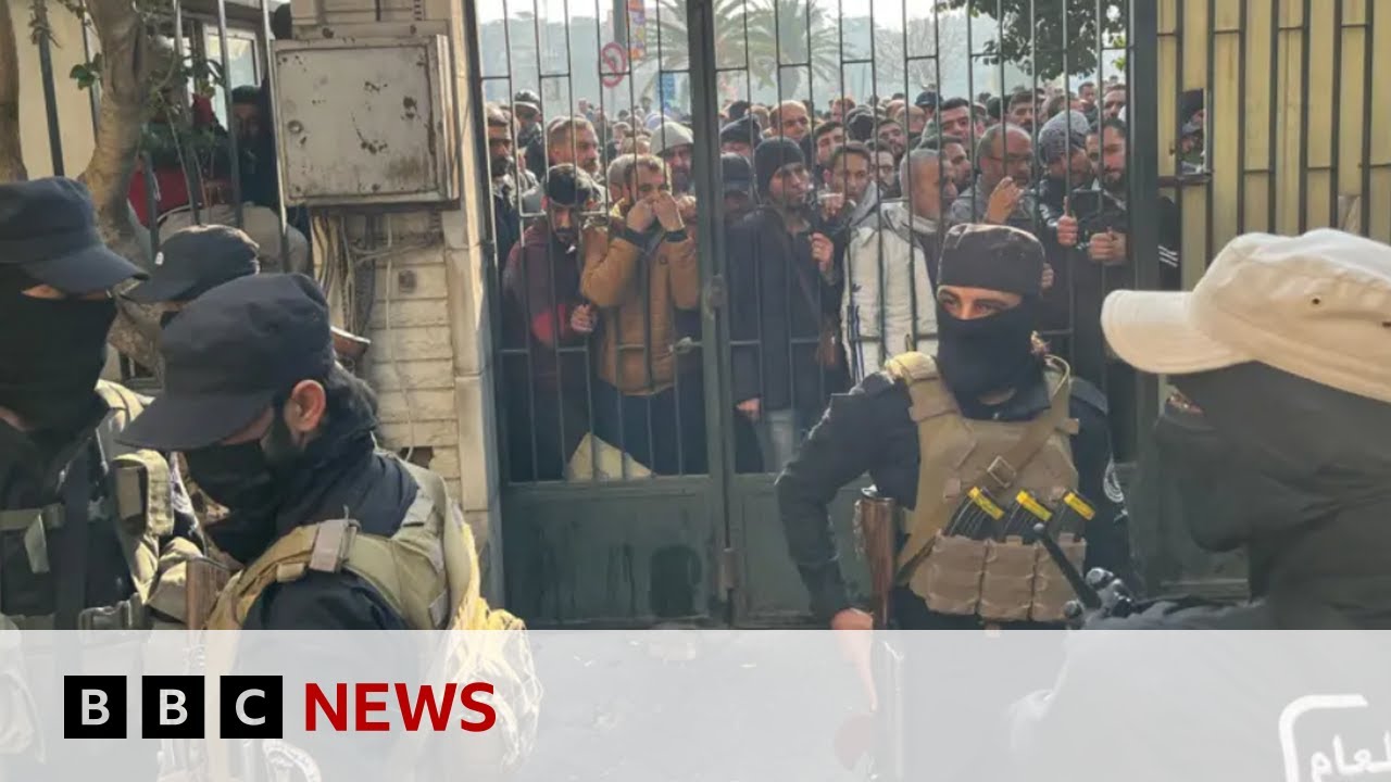 Assad’s soldiers give up their weapons in Syrian ‘reconciliation centres’ | BBC News