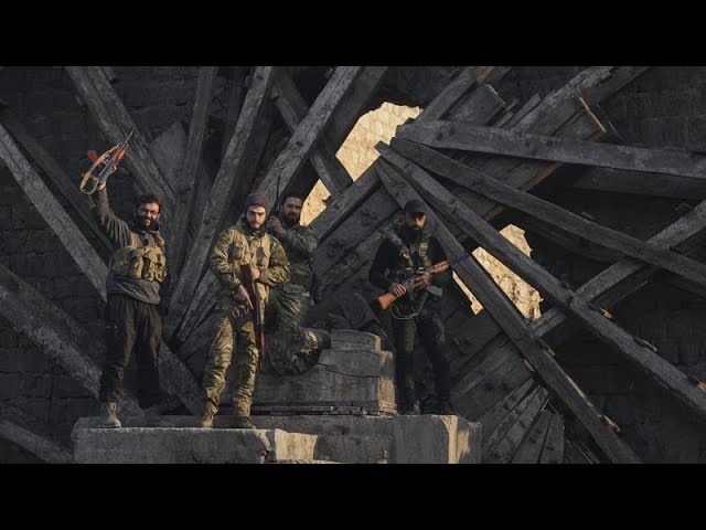 Syrian insurgents seize Damascus suburbs while state media deny Assad has fled