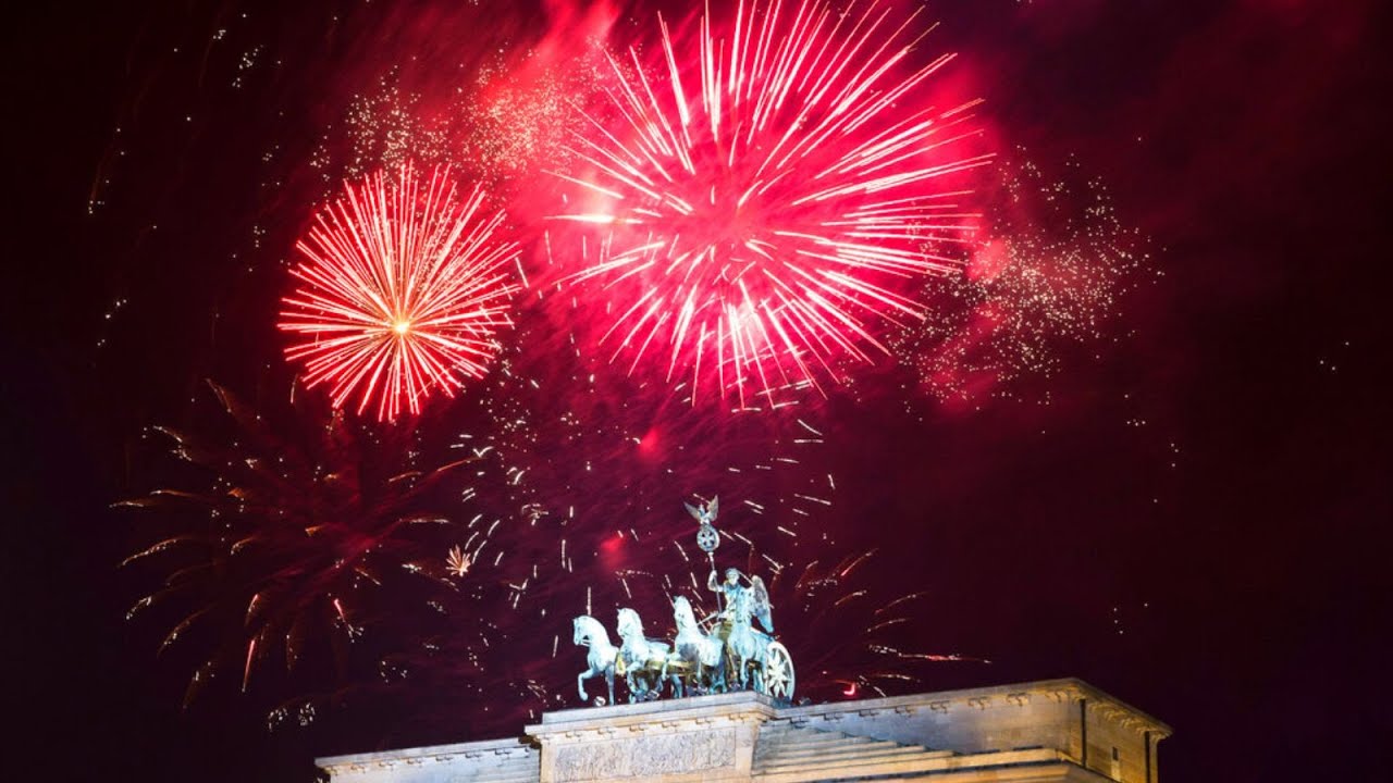 Happy New Year! Fireworks explode in the sky above the Quadriga on the Brandenburg Gate in Berlin