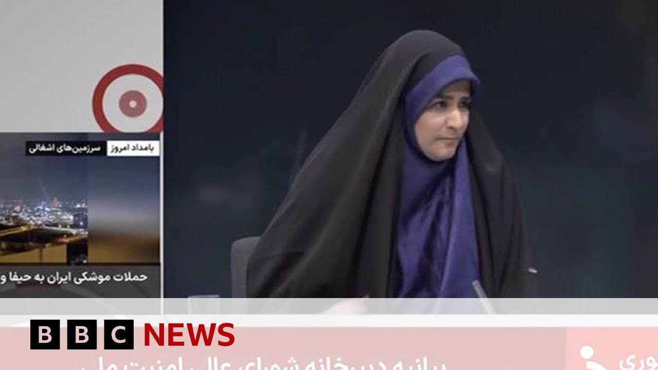 Debris falls in Iranian state TV studio during live broadcast as Israeli strikes continue | BBC News