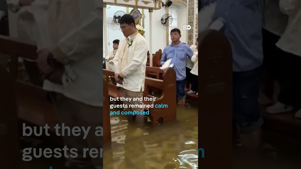 Filipino couple walk down flooded aisle on wedding day  | DW News