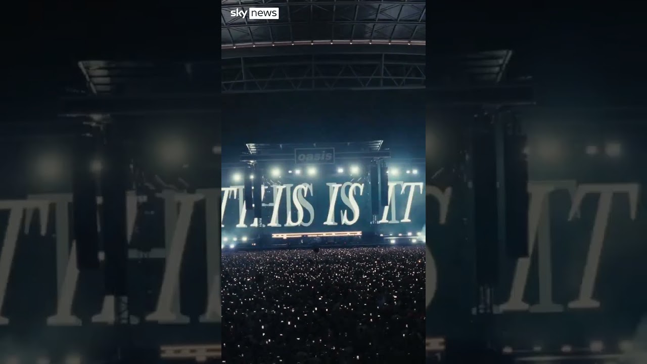 Gallagher brothers hold hands at start of worldwide Oasis tour