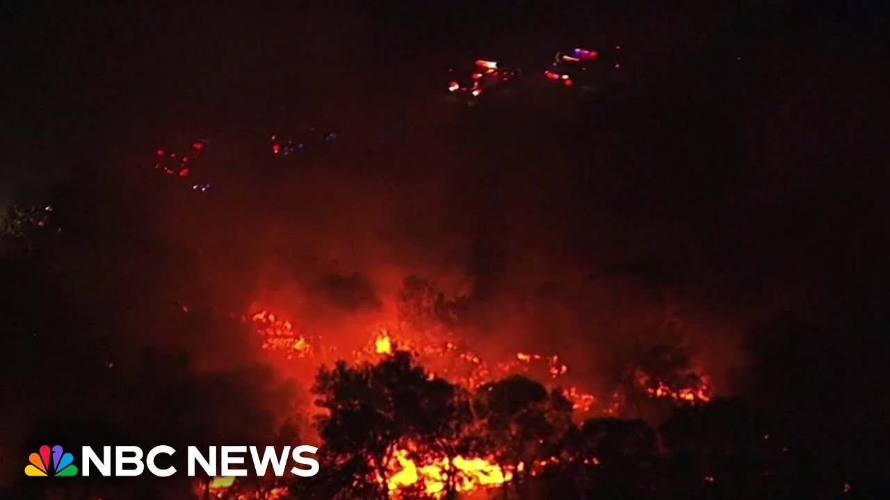Extreme weather continues across the U.S. with wildfires, torrential rain and record heat
