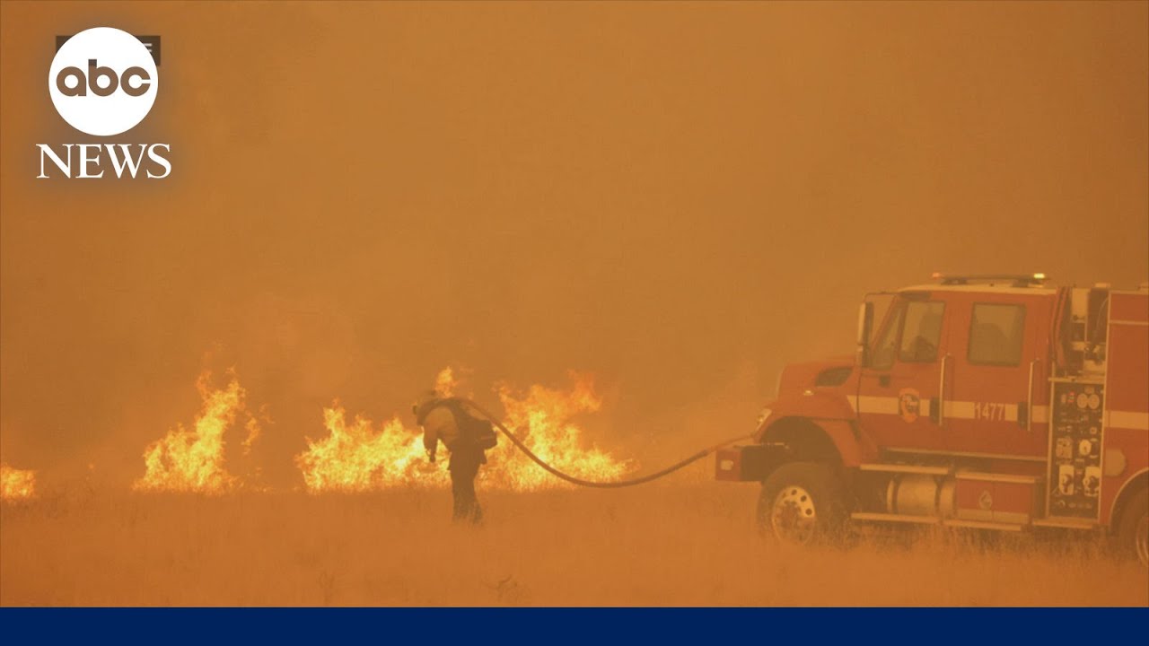 Firefighters battle flames in California as heatwave scorches West