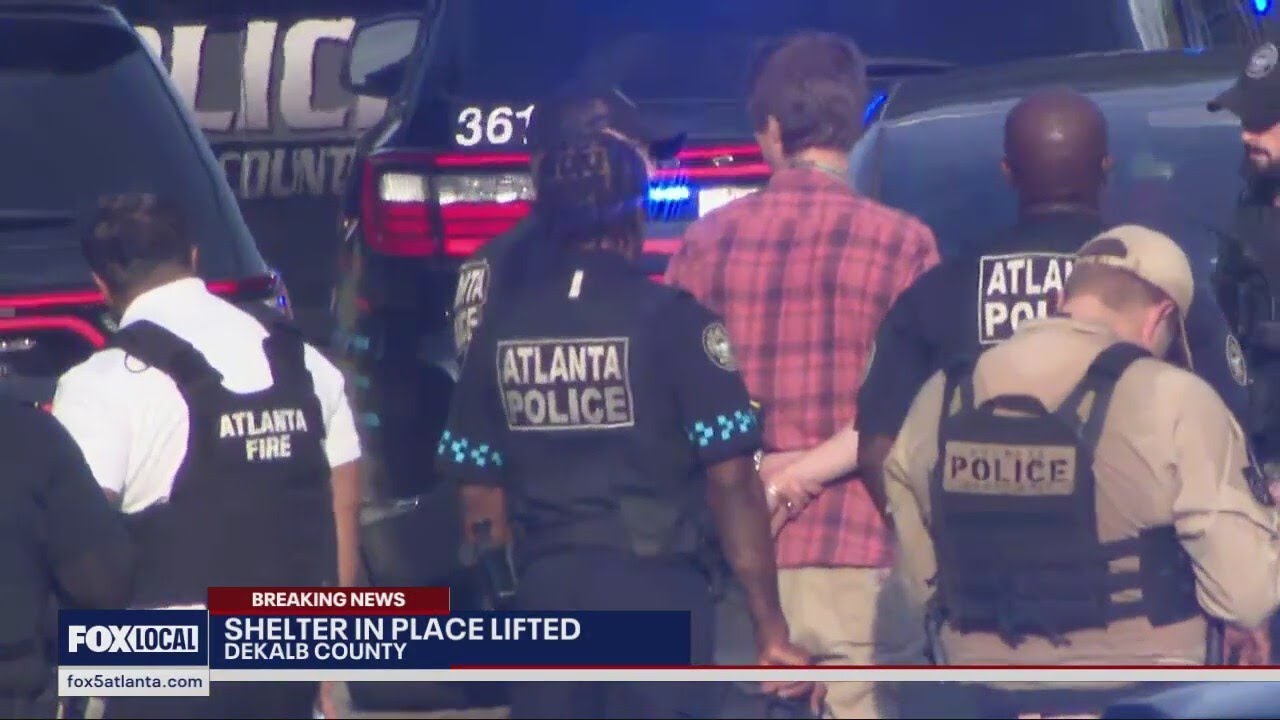 Man arrested near deadly Emory Point shooting scene