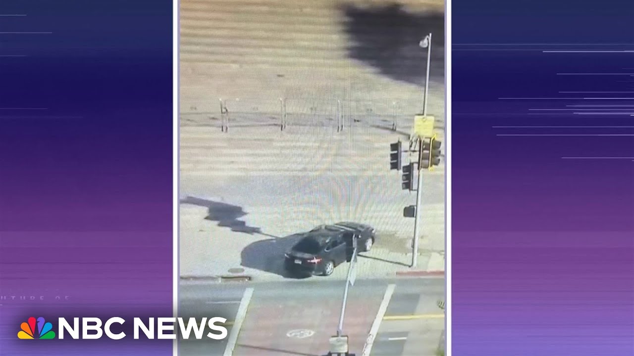 Man crashes into L.A. City Hall steps and barricades himself in car