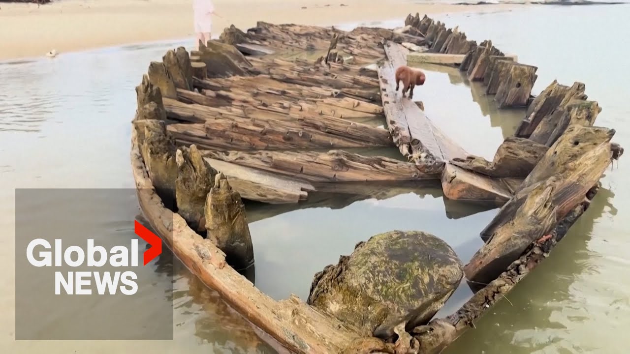 Centuries-old shipwreck exposed on Vietnam beach after Typhoon Kalmaegi