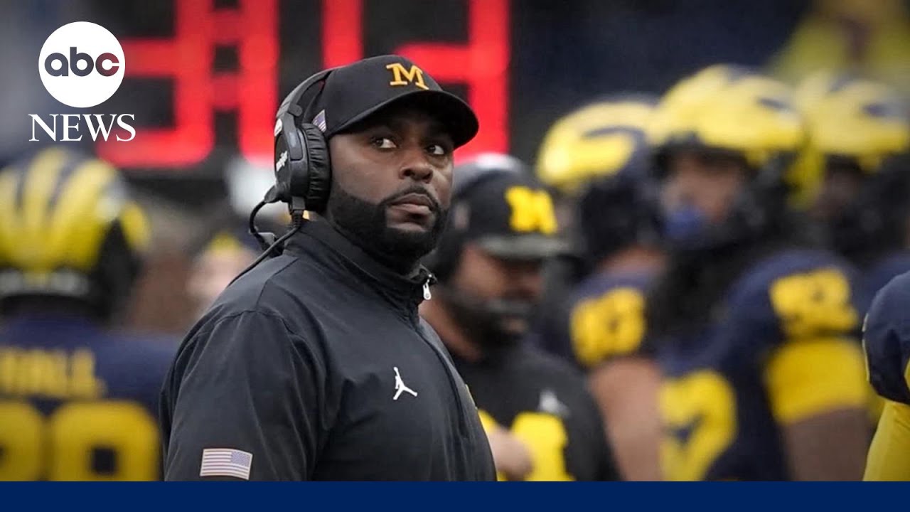 Fired University of Michigan football coach charged with home invasion, stalking