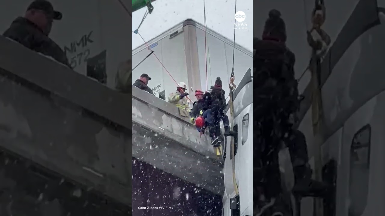 Truck driver rescued from tractor-trailer hanging off bridge in West Virginia