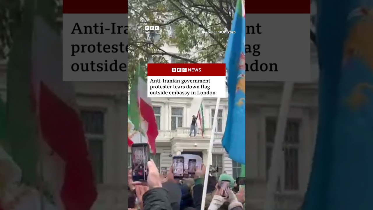 Anti-Iranian government protester tears down flag outside embassy in London. #Iran #London #BBCNews