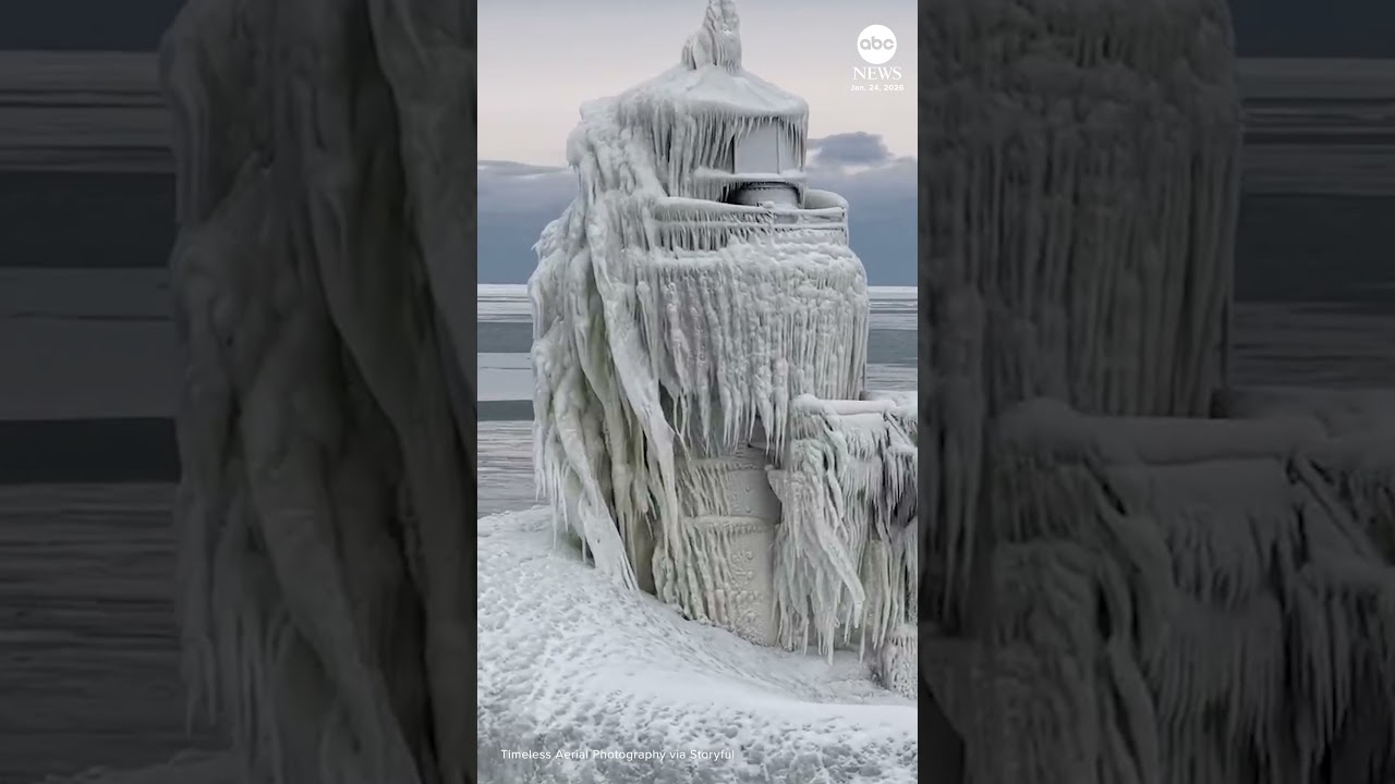Footage shows people walking along ice-covered Michigan pier