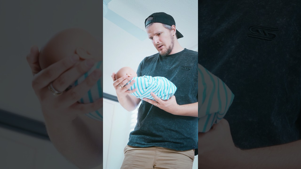 Rubik’s Cube champion holds his son for the first time
