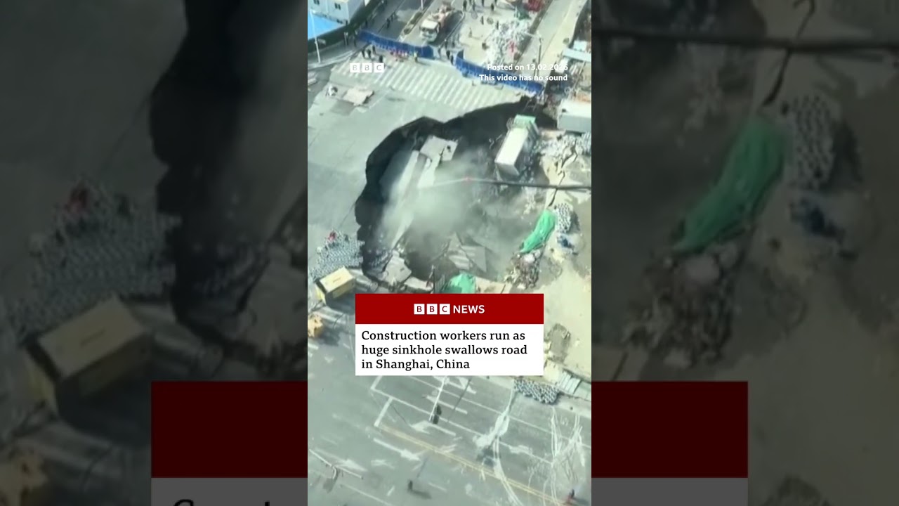 Construction workers run as huge sinkhole swallows road in Shanghai, China. #BBCNews