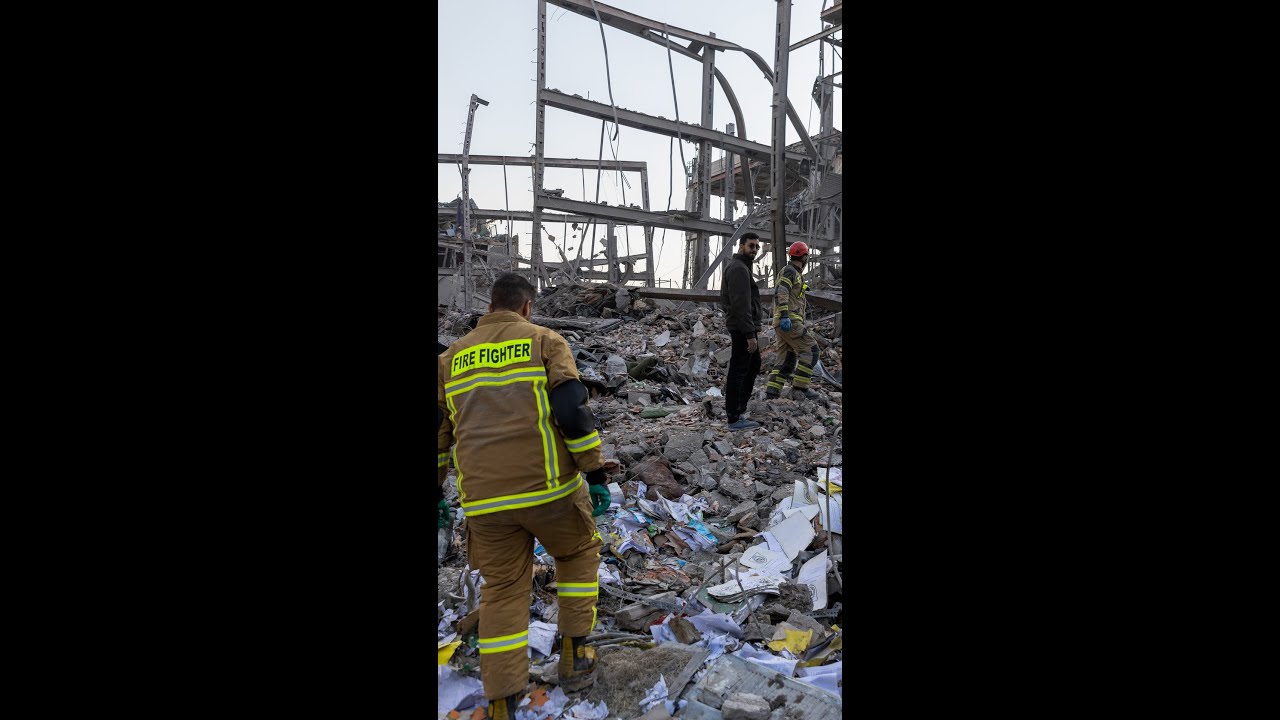 Damaged Buildings, Vehicles Seen After Strikes on Iran