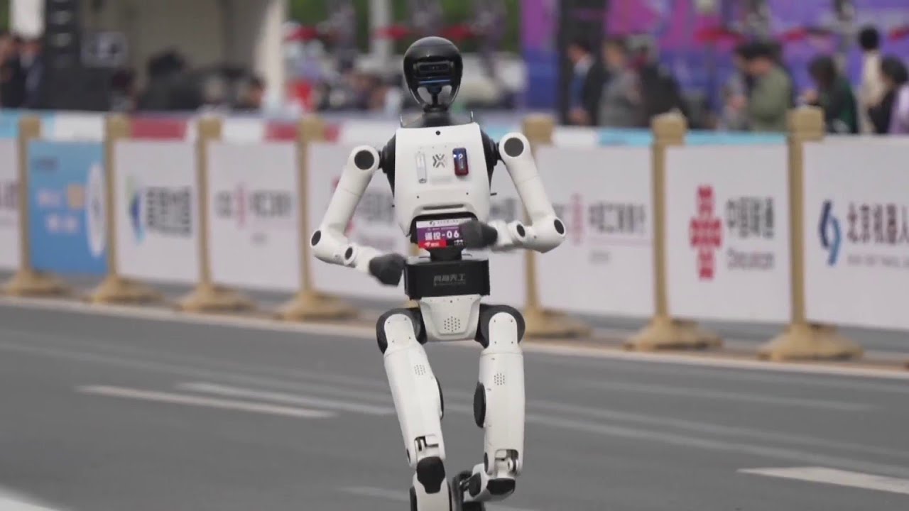 Humanoid robots race runners at Beijing half marathon