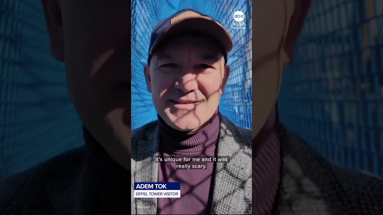 Tourists brave rope bridge suspended 200 feet up Eiffel Tower