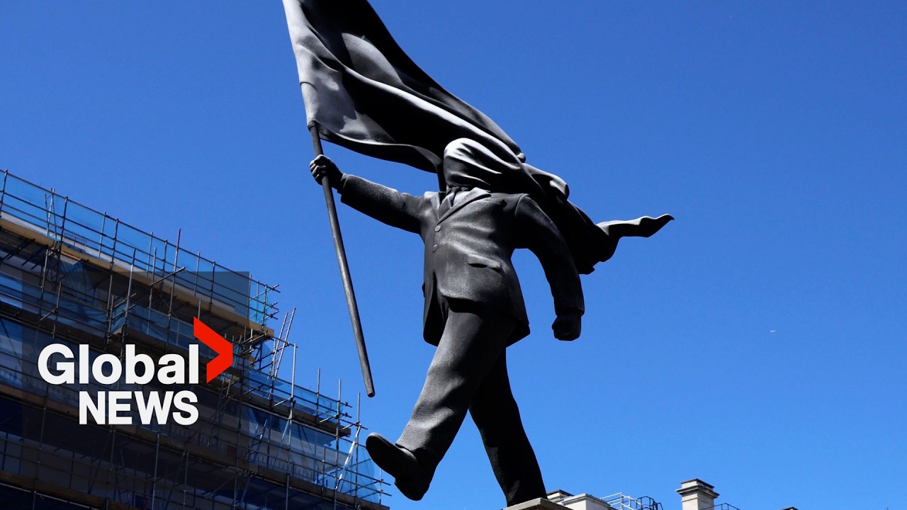 Large Banksy statue appears in London as locals and tourists snap pictures