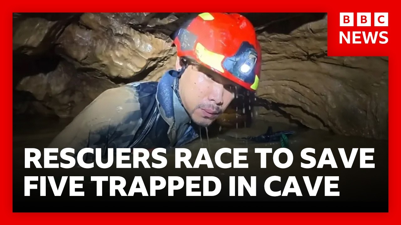Rescuers race to free five people trapped in flooded cave in Laos | BBC News