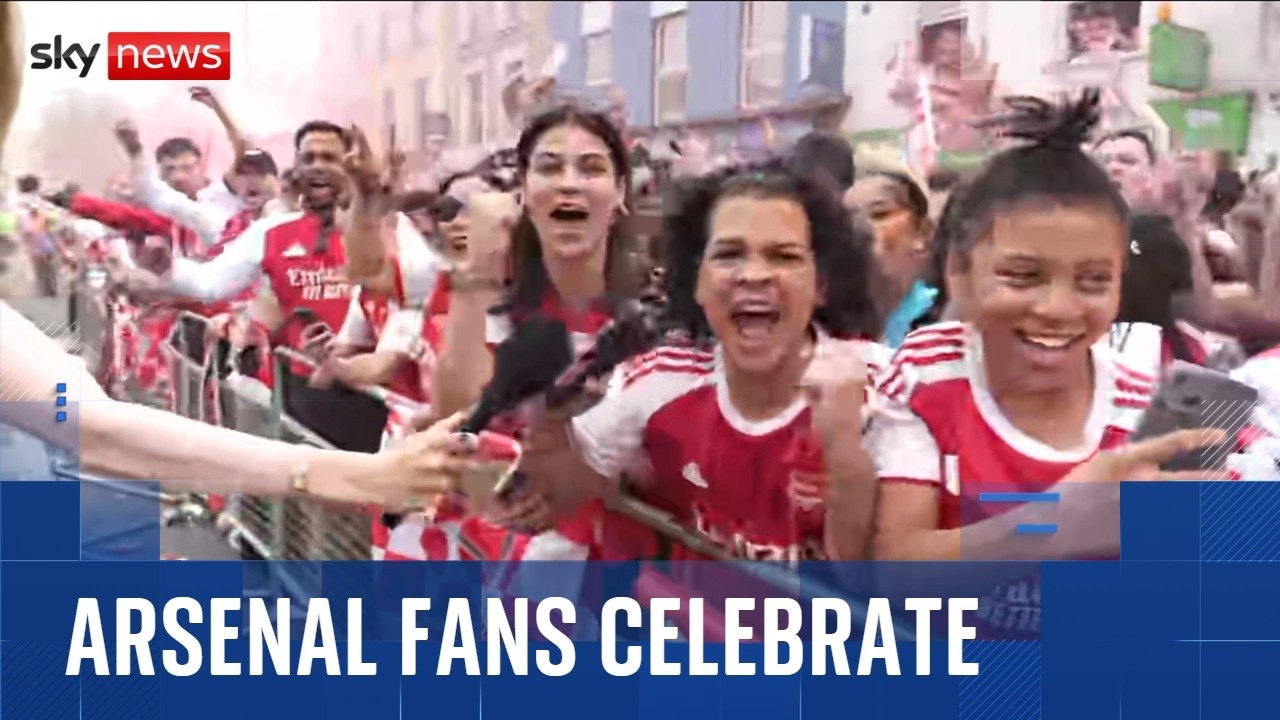 Thousands of Arsenal fans line the streets of North London for Premier League trophy parade