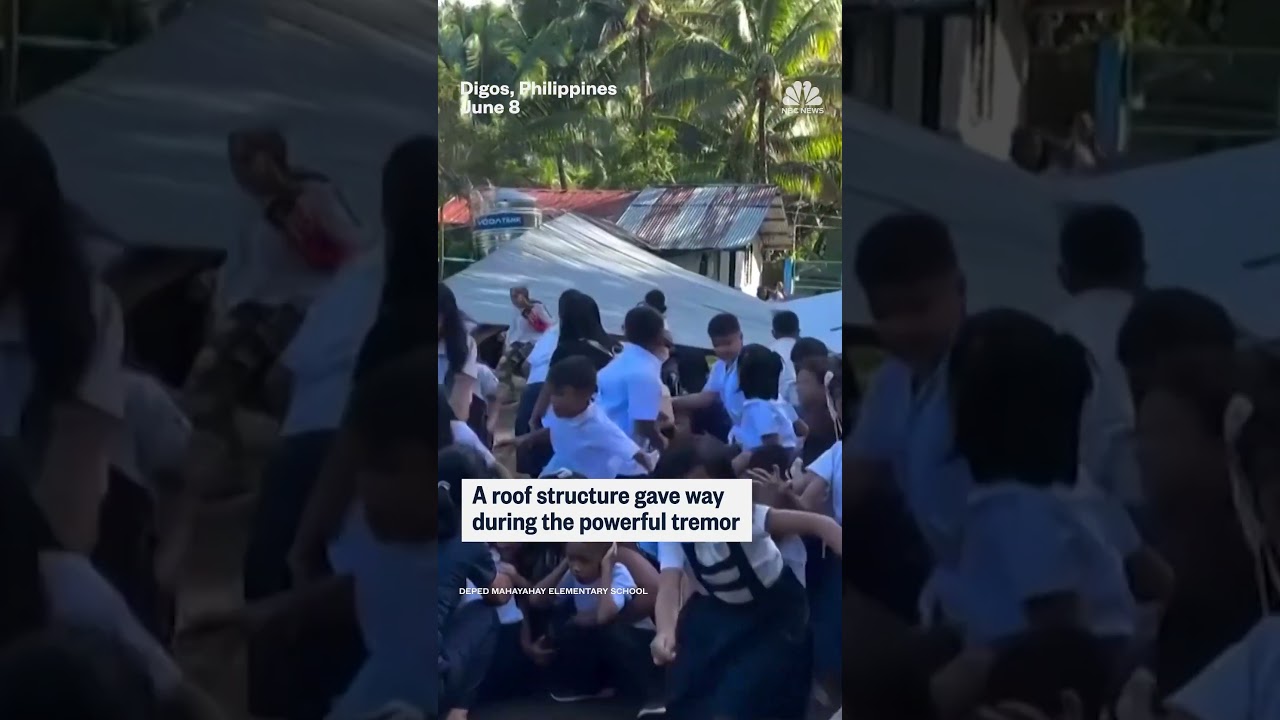 Students are rocked back and forth during 7.8-magnitude Philippines earthquake