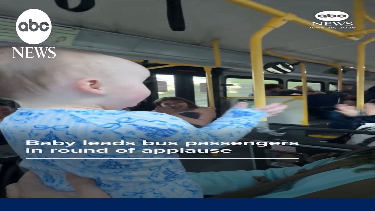 Baby leads bus passengers in round of applause
