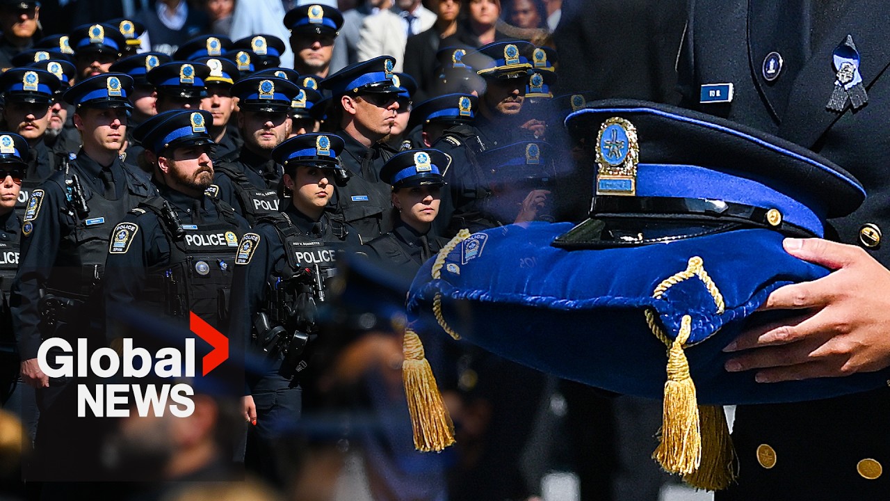 Police officers march in Montreal ahead of funeral for officer killed in shooting