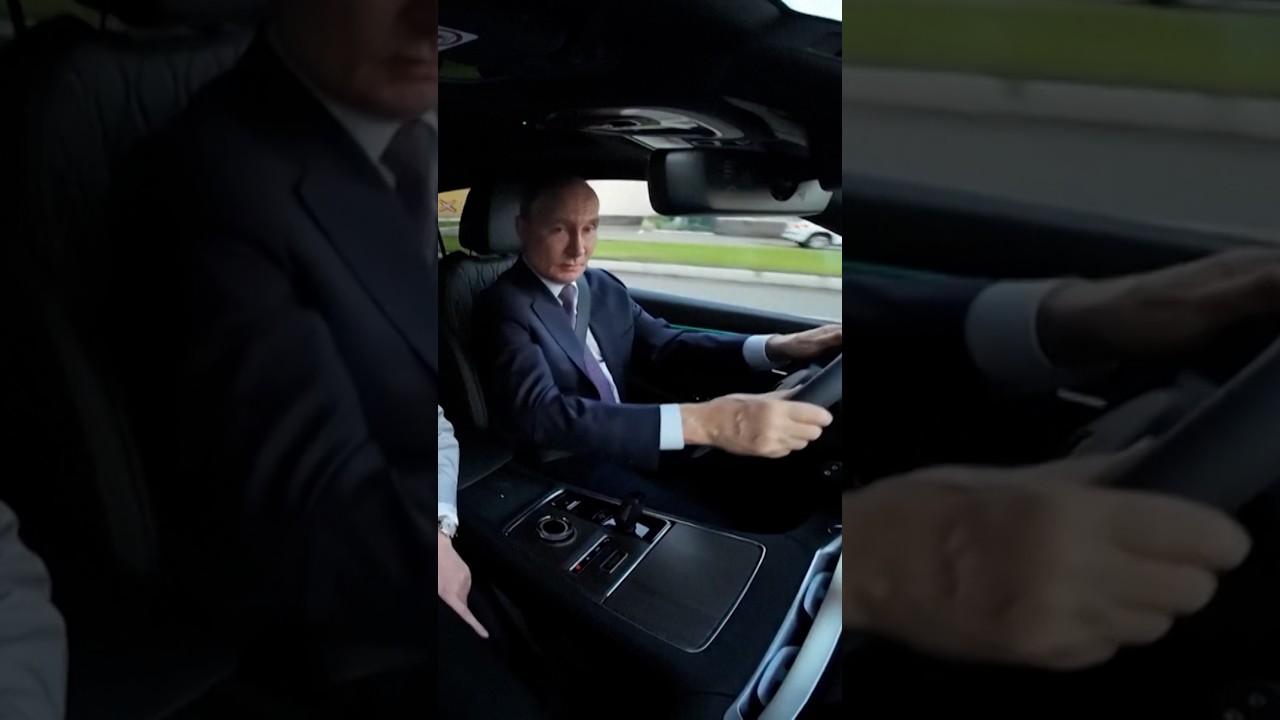 Putin takes new Volga SUV for test drive at factory