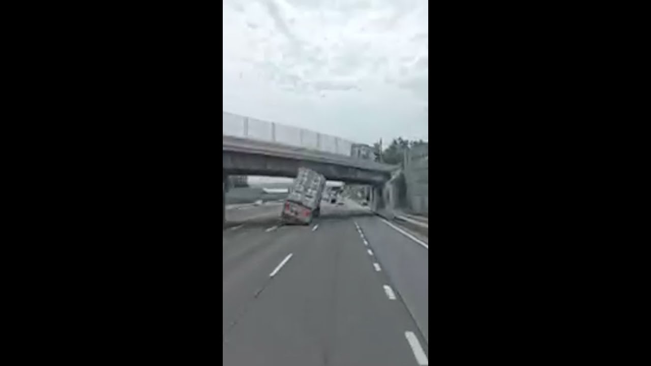 Tractor trailer slams into overpass and flips in New York