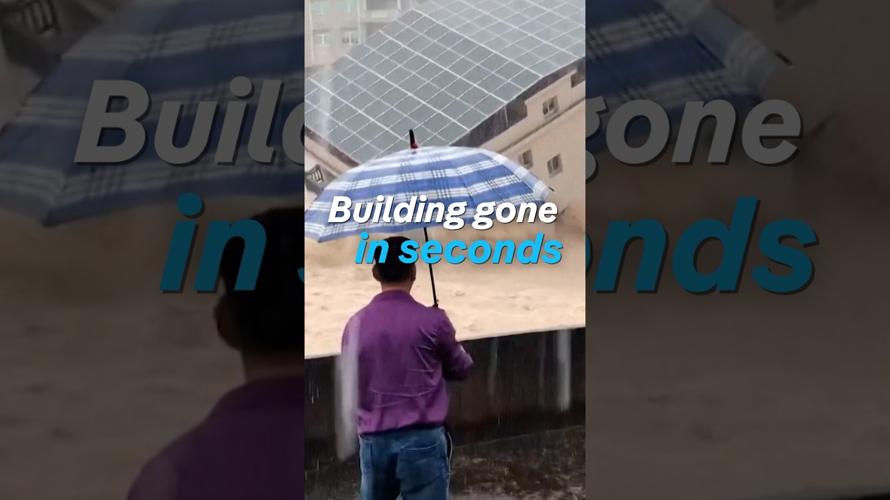 Watch floodwaters swallow an entire building in seconds | DW News