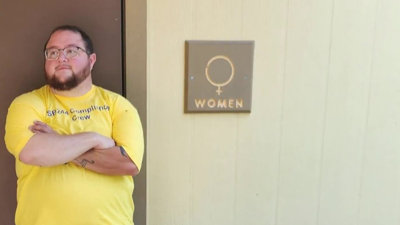 Kansas trans men protest state’s bathroom law by following it