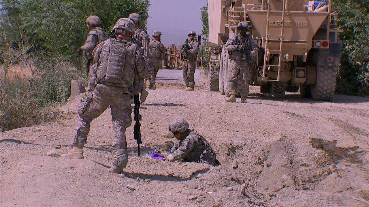 On the road with a bomb-hunting unit in Afghanistan | 60 Minutes Archive