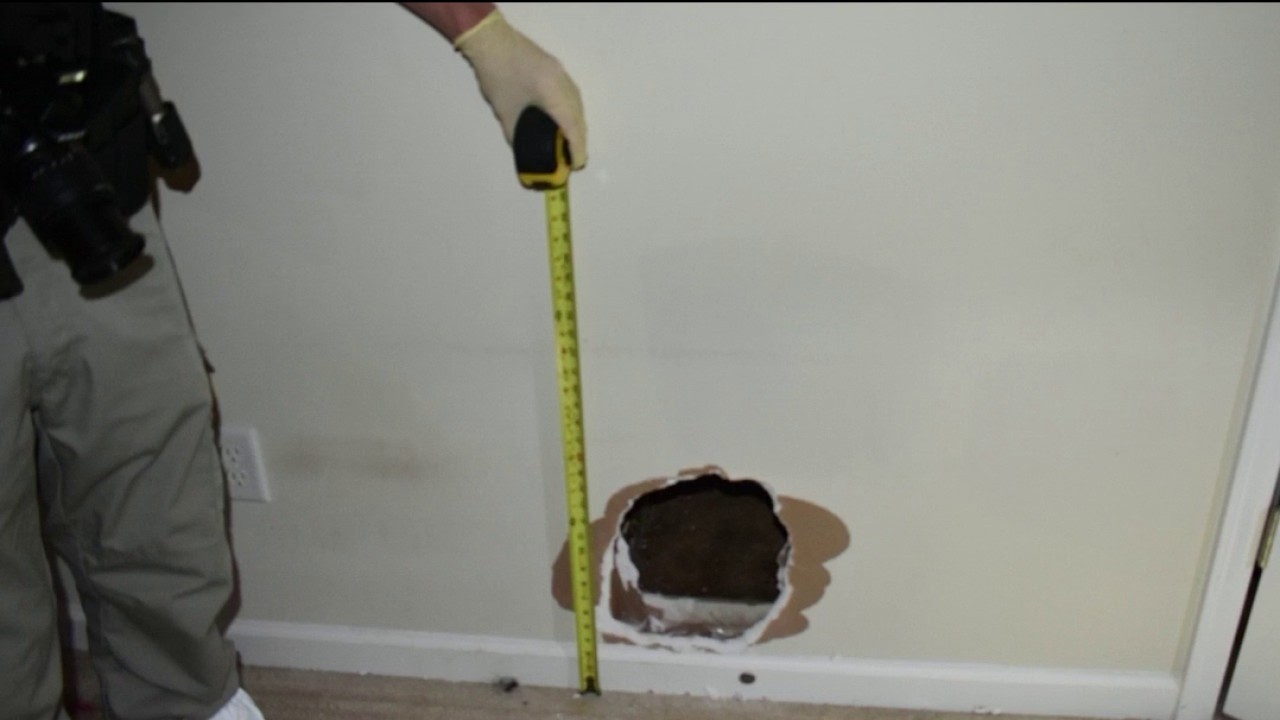 Trapped child claws through sheetrock to flee